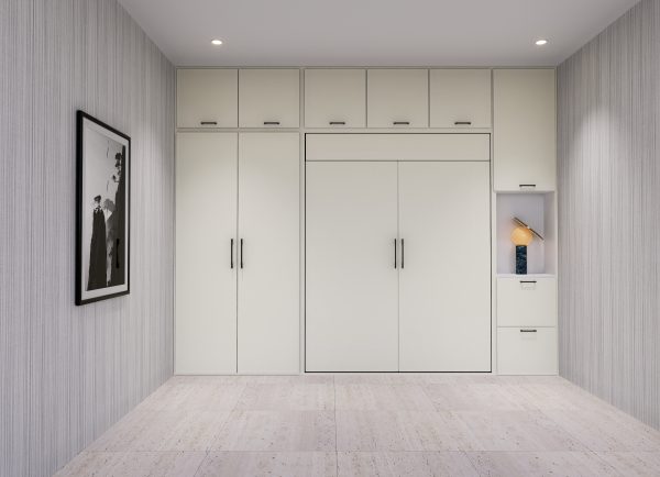 A modern hide a bed integrated into a sleek storage unit against a gray wall, with a small attached desk and open shelving.